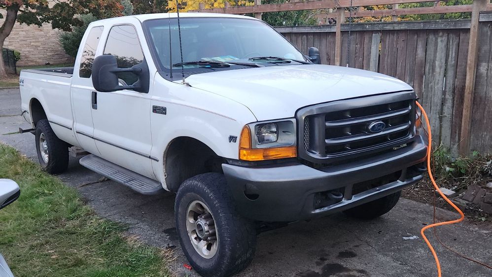 The Truck as it sits now with the new 3 Leaf front springs. A level ride.